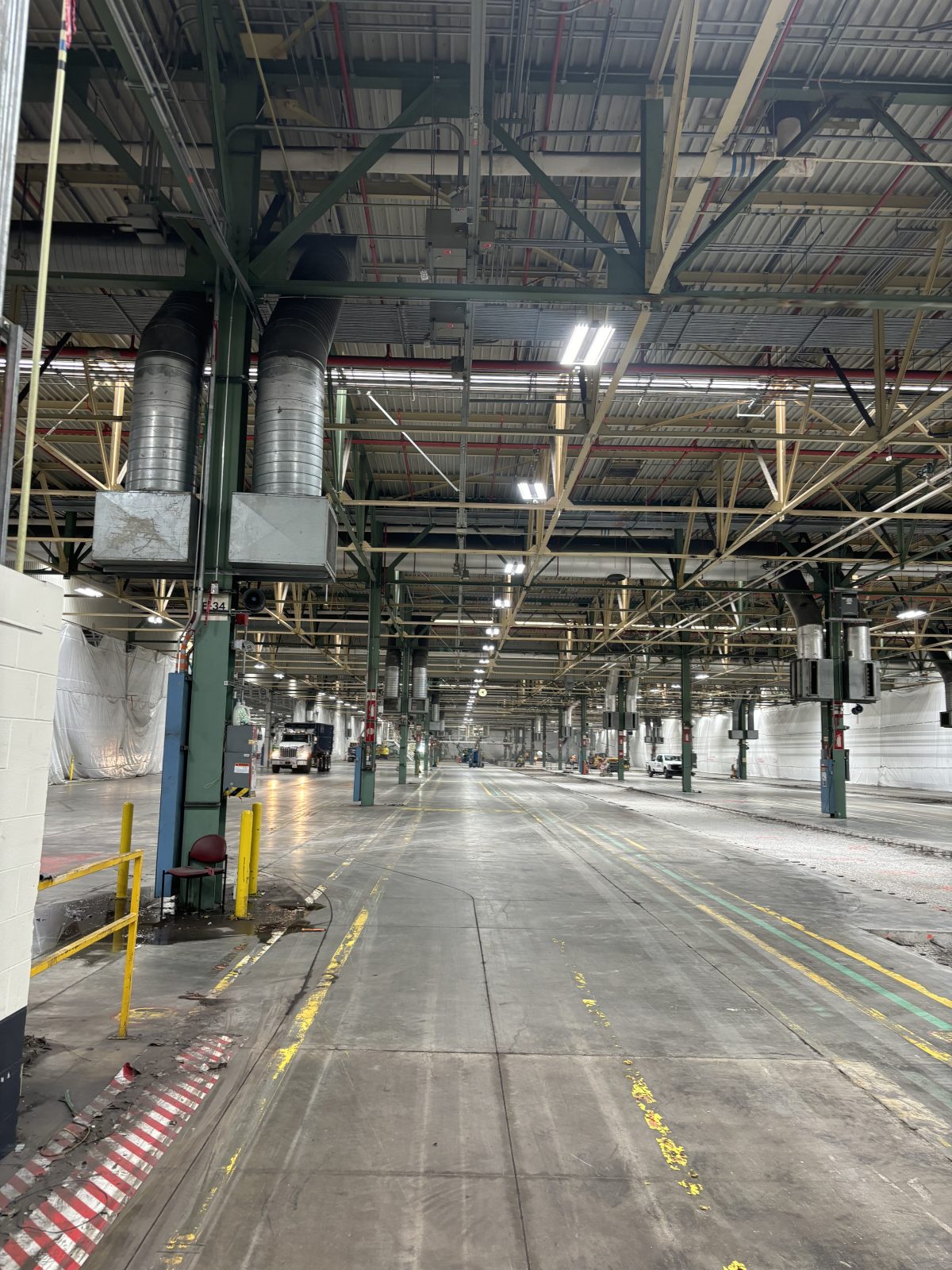 Cleared production floor after bay and conveyor strip-out at the Toyota assembly facility